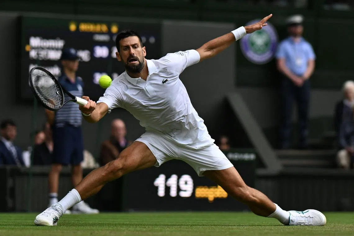 Novak Djokovic plays a forehand return to Serbia's Miomir Kecmanovic during their third round match at Wimbledon.