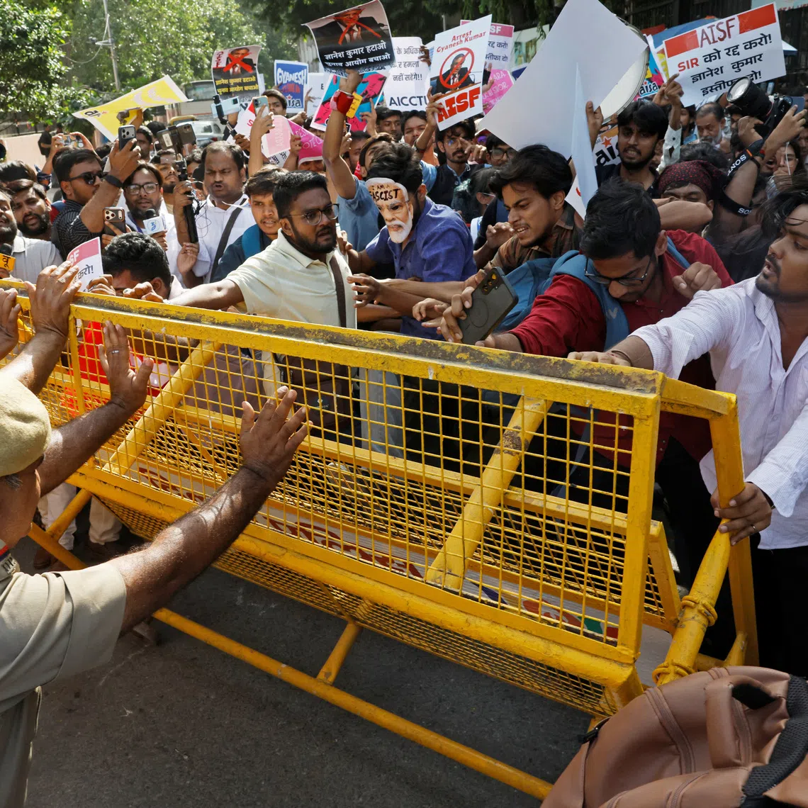 Demonstrators pushing against a police barricade during a protest demanding the resignation of India’s Chief Election Commissioner Gyanesh Kumar, in New Delhi, on Oct 3.