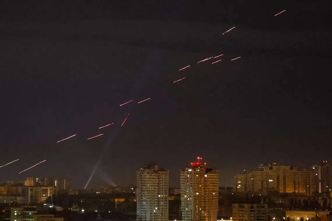 Tracers are seen in the night sky as Ukrainian servicemen fire at the drone during a Russian drone strike, amid Russia's attack on Ukraine, in Kyiv, Ukraine on Oct 30, 2024.