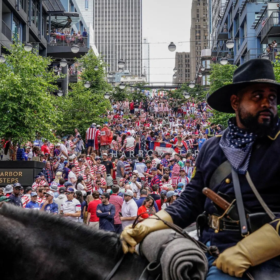 Soccer Football - FIFA World Cup 2026 - Group D - United States v Australia - Fans in Seattle - Seattle, Washington, U.S. - June 19, 2026 A member of the Buffalo Soldiers of Seattle rides a horse as United States fans gather at a screening in Seattle ahead of the match. REUTERS/David Ryder