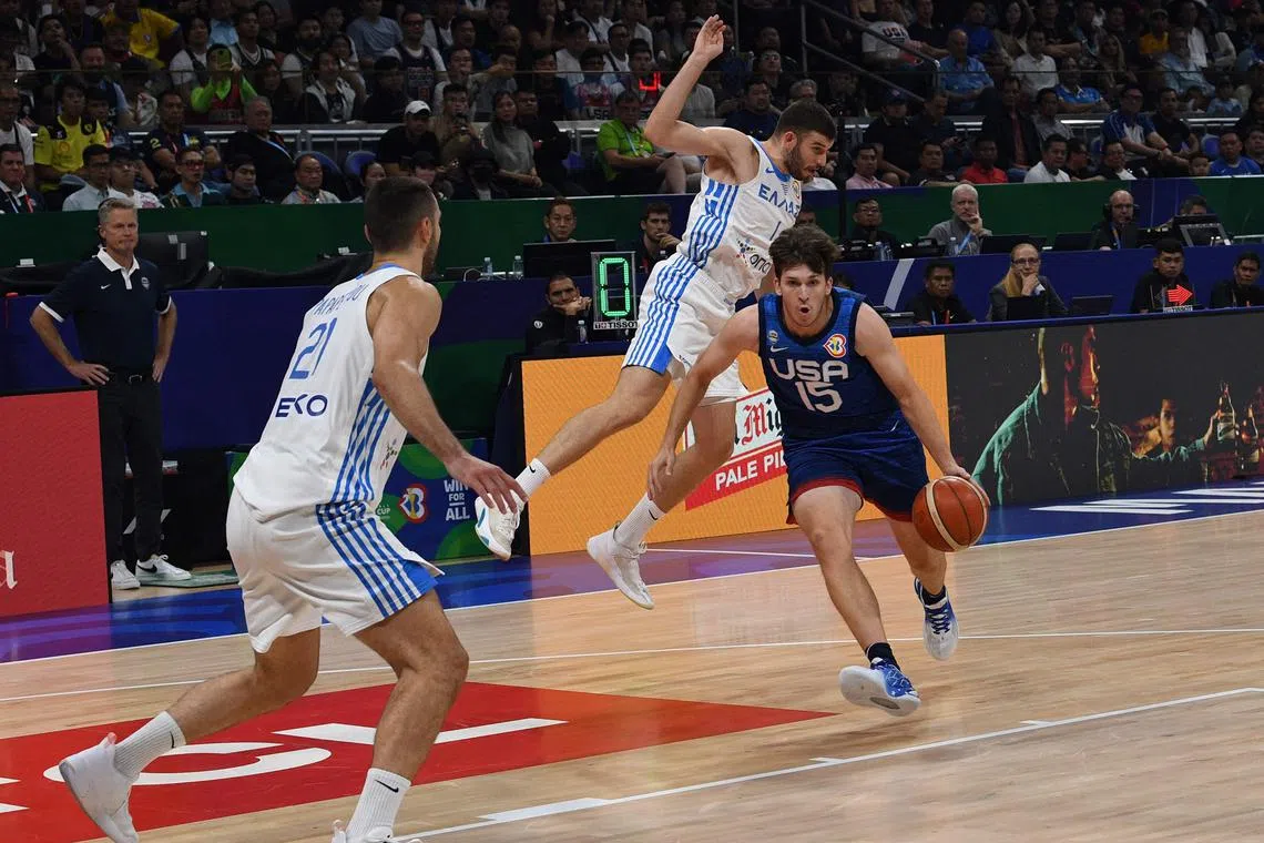 The United States' Austin Reaves dribbles past Greece's Nikos Rogkavopoulos during their Fiba World Cup match in Manila. The Americans won 109-81.