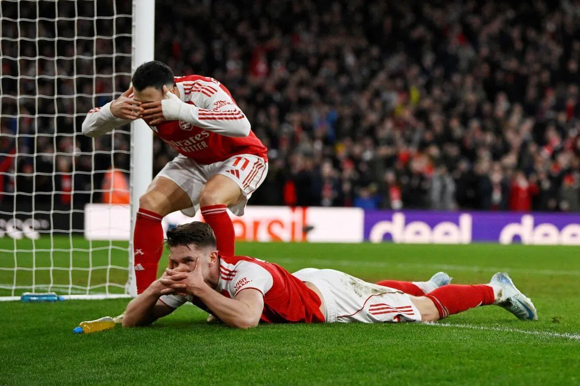 Arsenal's Viktor Gyokeres (lying down) celebrates scoring their third goal with Gabriel Martinelli during the 3-0 English Premier League win over Sunderland at the Emirates on Feb 7, 2026.