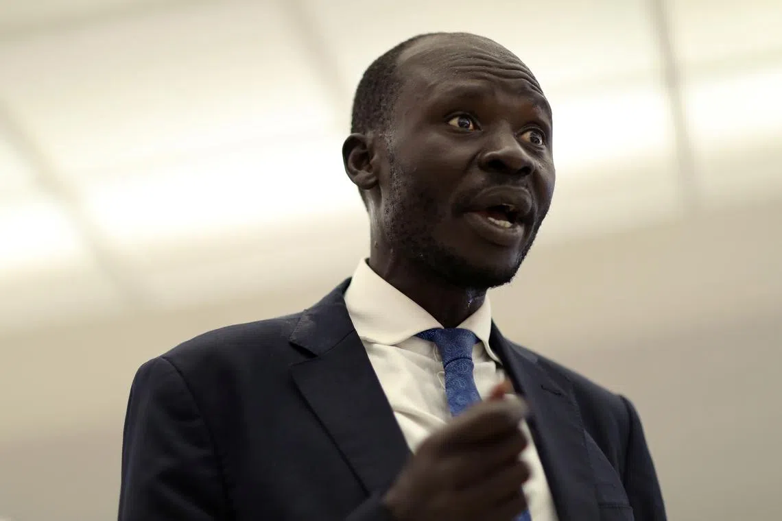 South Sudanese economist Peter Biar Ajak speaks to Reuters as he arrives at Dulles International Airport in Virginia, after fleeing Kenya with his family to the U.S., July 23, 2020.  REUTERS/Leah Millis/File Photo