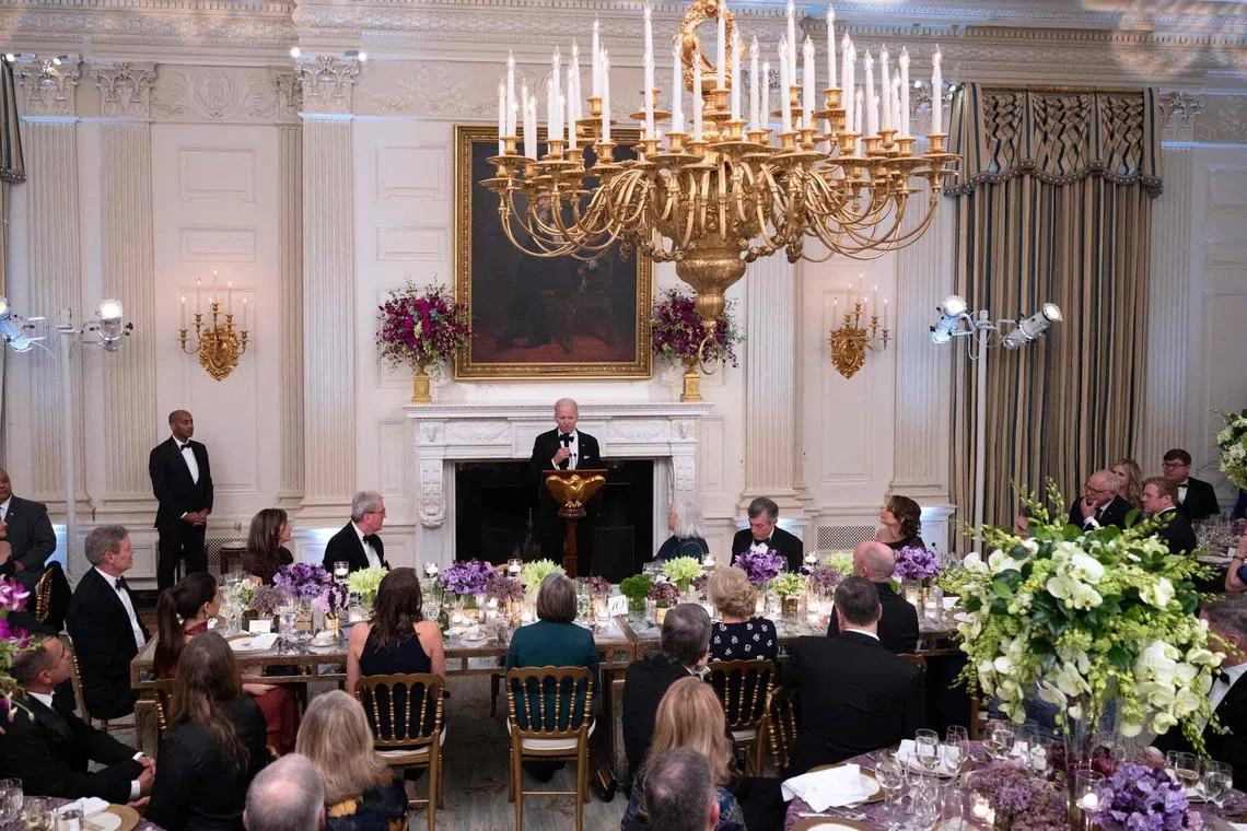 US President Joe Biden speaks as he welcomes Governors and their spouses for a black-tie dinner at the State Dining Room of the White House in Washington DC on Feb 11, 2023. 