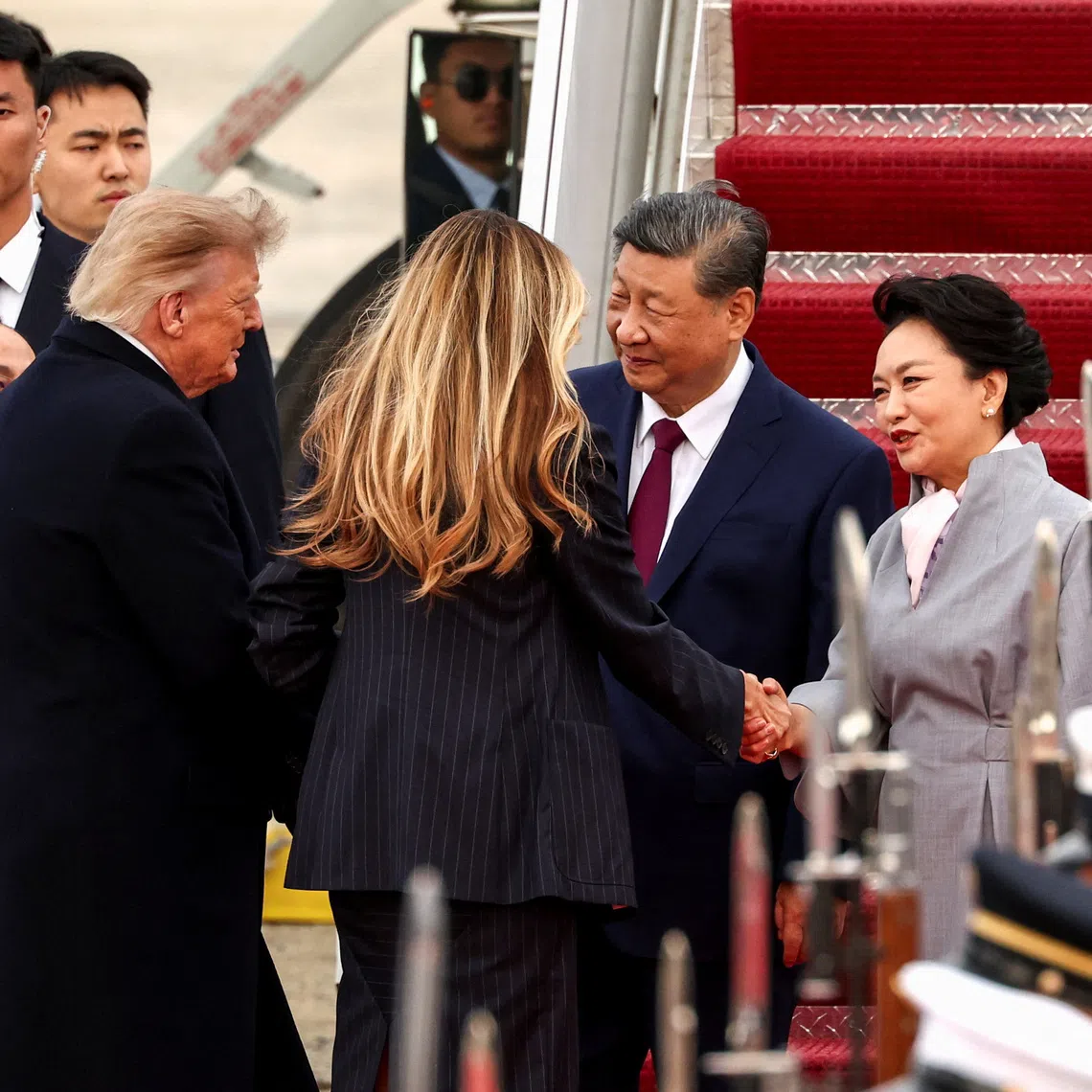 US President Donald Trump and his wife Melania greeting Chinese President Xi Jinping and his wife Peng Liyuan upon their arrival at Joint Base Andrews in Maryland on Sept 23.