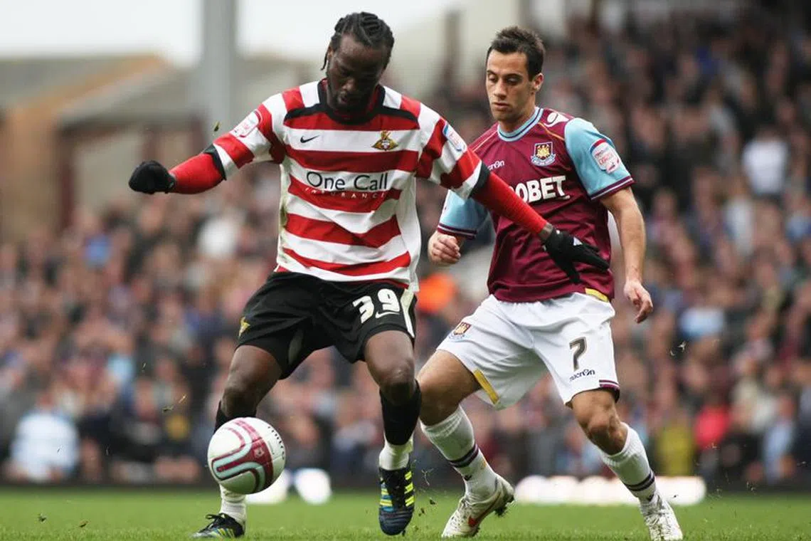 Football - West Ham United v Doncaster Rovers - npower Football League Championship  - Upton Park  - 11/12 - 10/3/12 
Doncaster Rovers' Pascal Chimbonda (L) and West Ham United's Sam Baldock in action 
Mandatory Credit: Action Images / Lee Mills/File photo