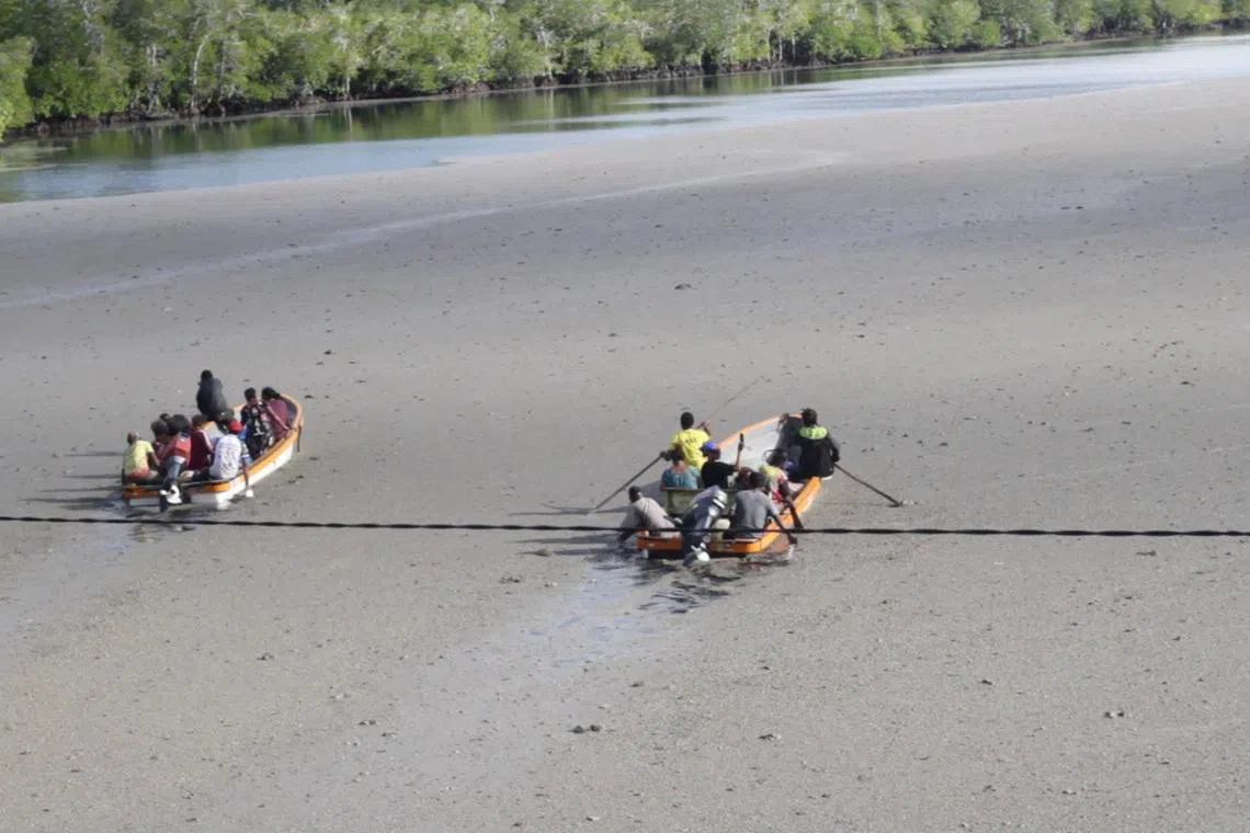 Locals raft through the pumice-covered Loniu Passage, following an undersea eruption, in Manus Province, Papua New Guinea, June 8, 2026, in this screengrab obtained from a social media video. Bellamy Popot/via REUTERS
