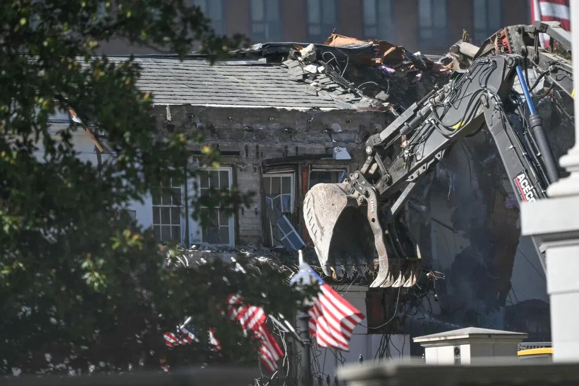 Heavy machinery tears down a section of the East Wing of the White House on Oct 21.
