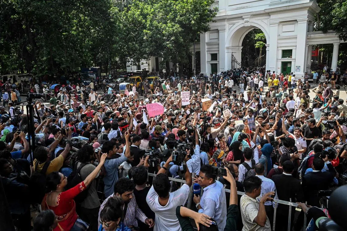 People take part in a protest march outside the High Court building demanding justice for the victims arrested and killed in the recent countrywide violence.