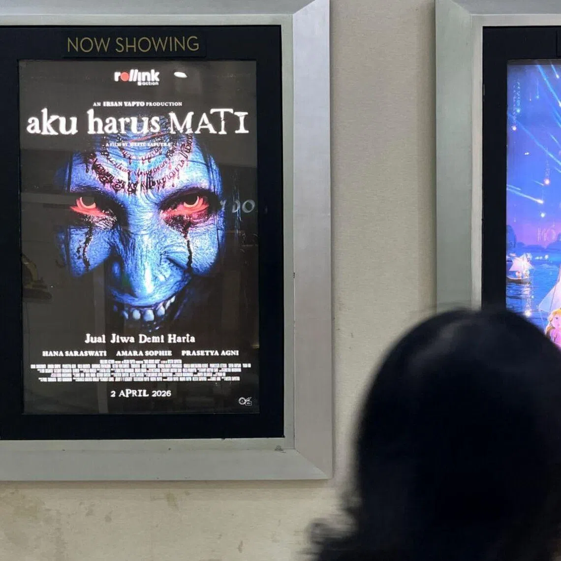 The posters feature the phrases "I Must Die" and "Sell My Soul for Wealth" against the backdrop of a blue, red-eyed creature.