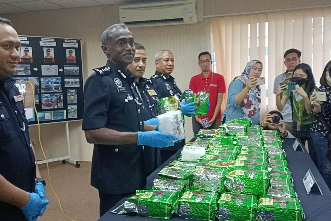 Johor police chief Commissioner M. Kumar with the haul of drugs police seized from multiple raids.