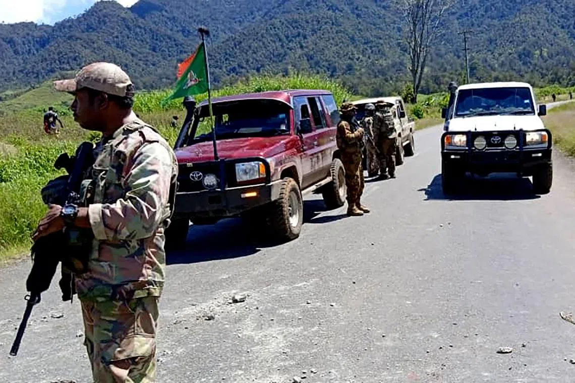 Officials patrolling near the town of Wabag, 600km northw-est of the capital Port Moresby. 
