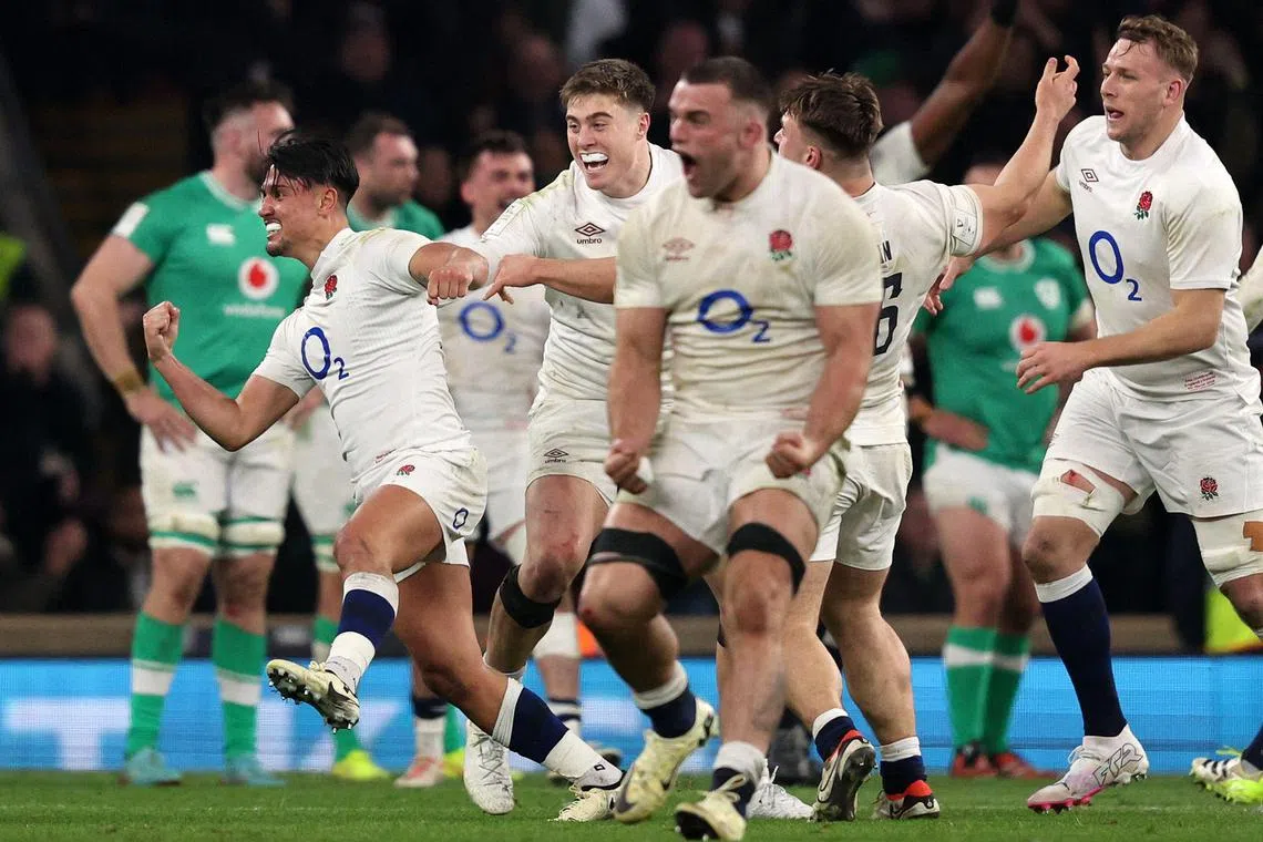 England's Marcus Smith (left) celebrates scoring against Ireland, with a winning drop goal.