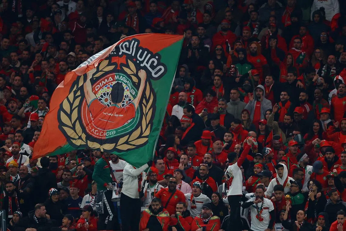 FILE PHOTO: Soccer Football - CAF Africa Cup of Nations - Morocco 2025 - Final - Senegal v Morocco - Prince Moulay Abdellah Stadium, Rabat, Morocco - January 18, 2026 A Morocco fan waves a flag in the stands during the match REUTERS/Siphiwe Sibeko/ File Photo