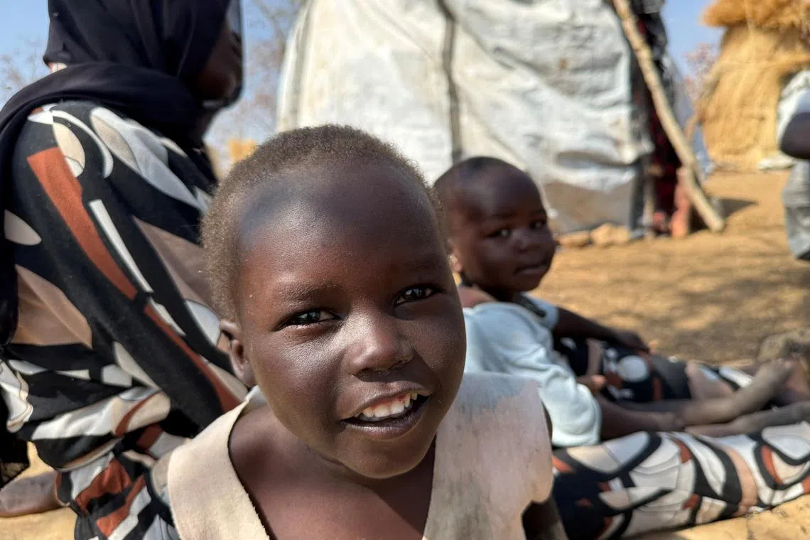 A boy reacts as he sits with his family, displaced from Kadugli, at Embal Camp in Engpung County, Sudan, January 30, 2026. Karl Schembri/Norweigan Refugee Council/Handout via REUTERS