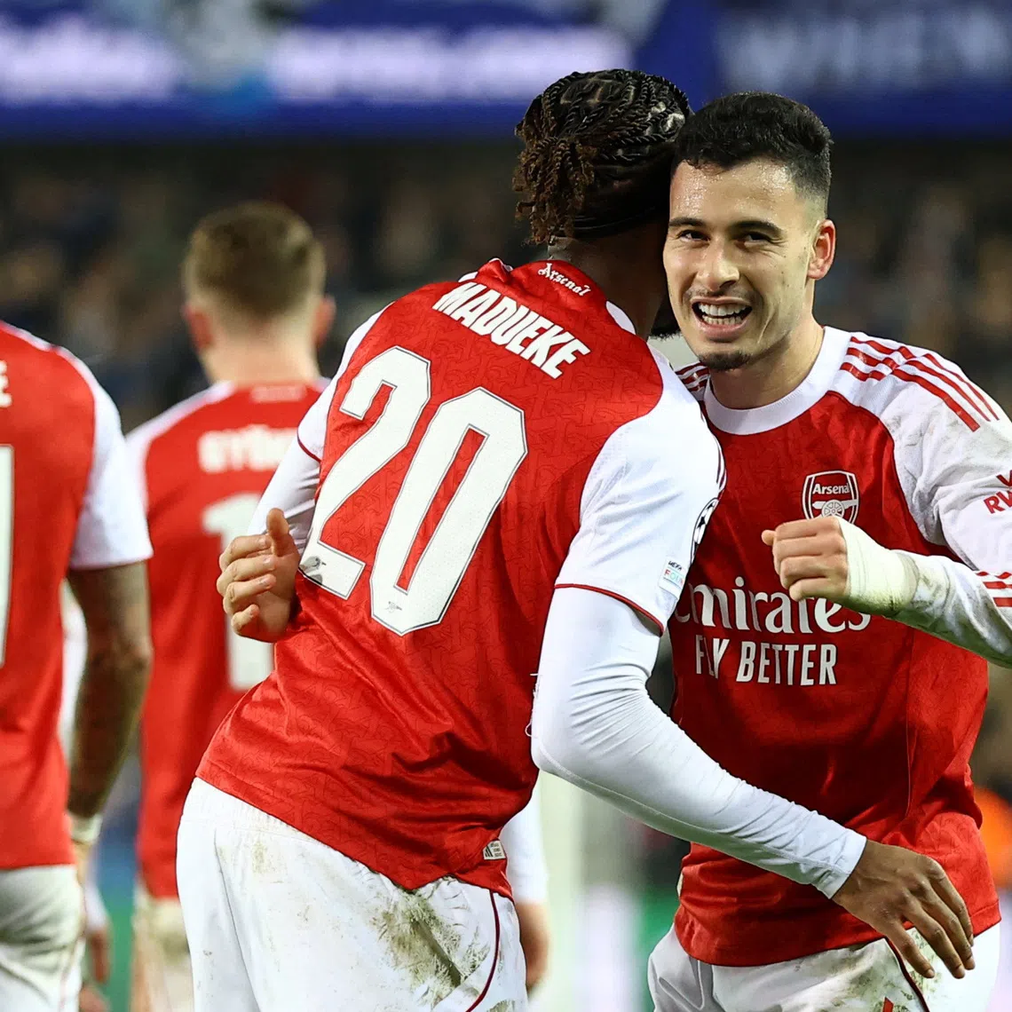 Soccer Football - UEFA Champions League - Club Brugge v Arsenal - Jan Breydel Stadium, Bruges, Belgium - December 10, 2025 Arsenal's Gabriel Martinelli celebrates scoring their third goal with Arsenal's Noni Madueke REUTERS/Yves Herman