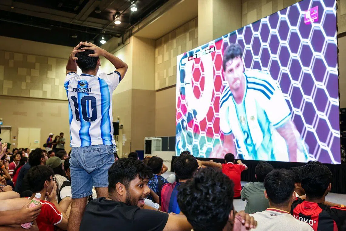 An Argentinian fan reacting in disappointment after a missed opportunity during the live screening of the FIFA World Cup 2026 final between Argentina and Spain at Our Tampines Hub in the early hours of July 20, 2026. ST PHOTO: BRIAN TEO