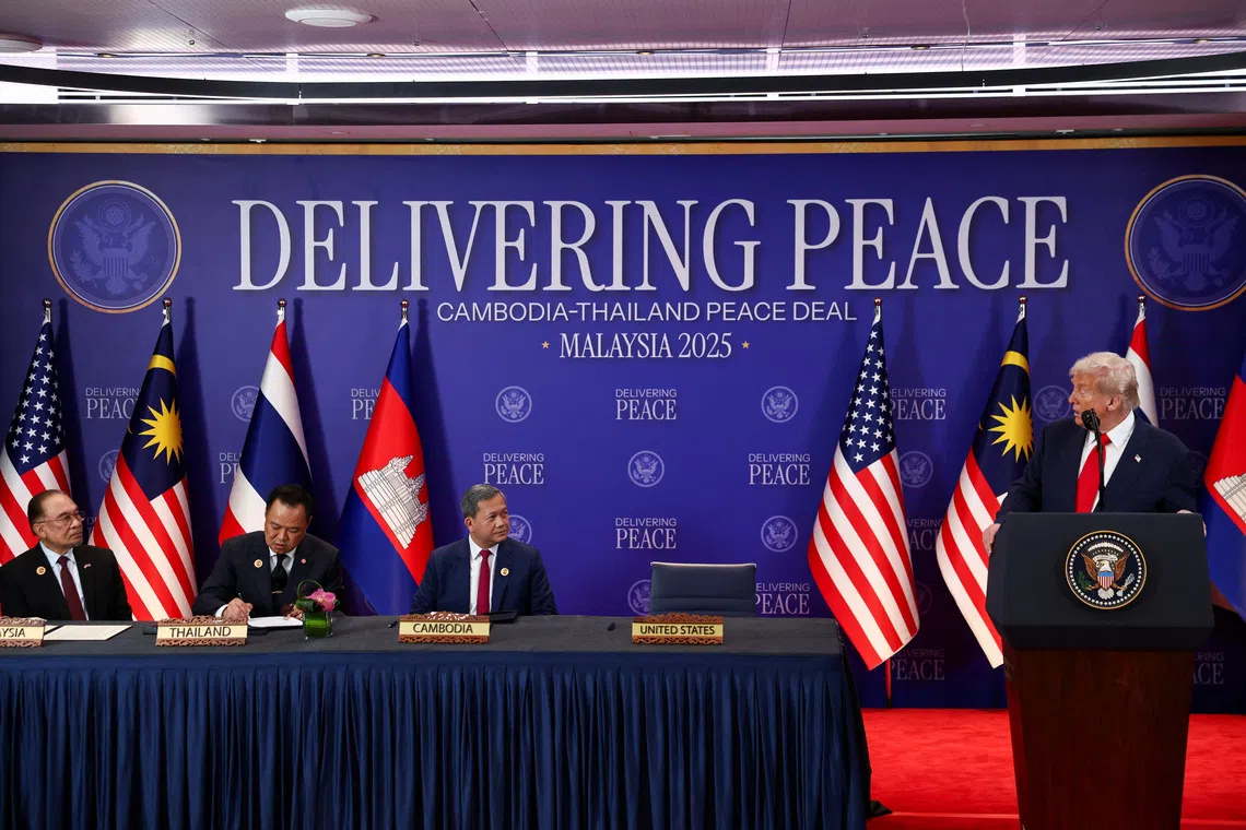 Malaysia's Prime Minister Anwar Ibrahim, Thailand's Prime Minister Anutin Charnvirakul and Cambodia’s Prime Minister Hun Manet look on as U.S. President Donald Trump speaks ahead of the signing of a ceasefire deal between Cambodia and Thailand on the sidelines of the 47th Association of Southeast Asian Nations (ASEAN) summit in Kuala Lumpur, Malaysia, October 26, 2025. REUTERS/Evelyn Hockstein