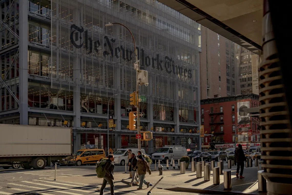 FILE -- The New York Times building in Manhattan, Dec. 20, 2022. The New York Times Company added 300,000 paid digital subscribers in the fourth quarter of 2023, the company said on Wednesday, helping to push annual revenue for digital subscriptions above $1 billion for the first time. (Amir Hamja/The New York Times)