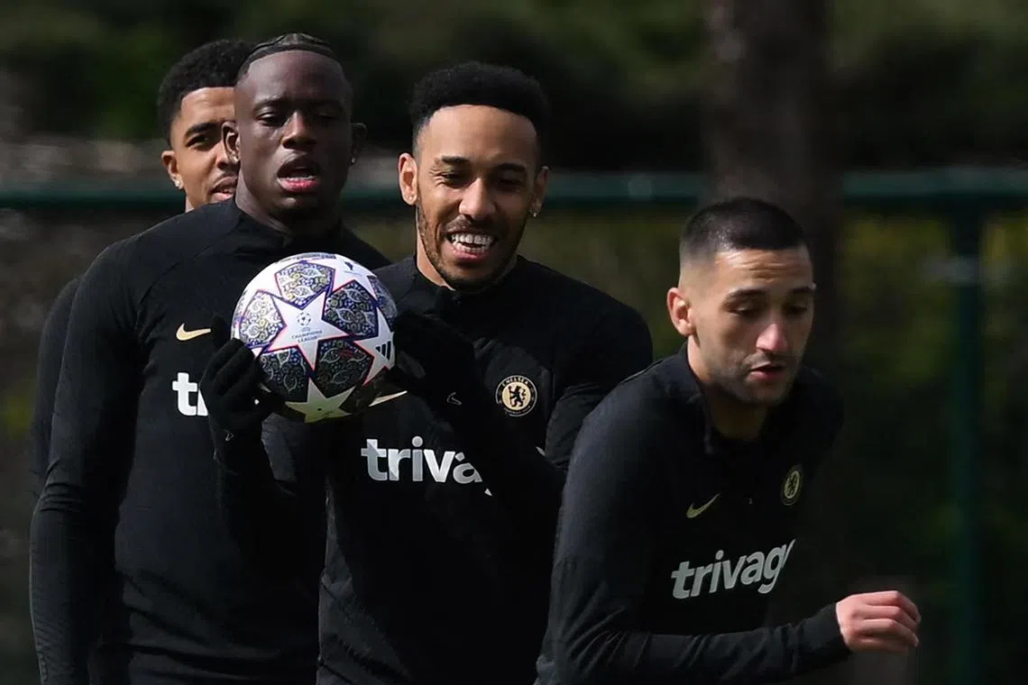 Chelsea striker Pierre-Emerick Aubameyang (centre) takes part in a team training session on the eve of their match against Real Madrid.