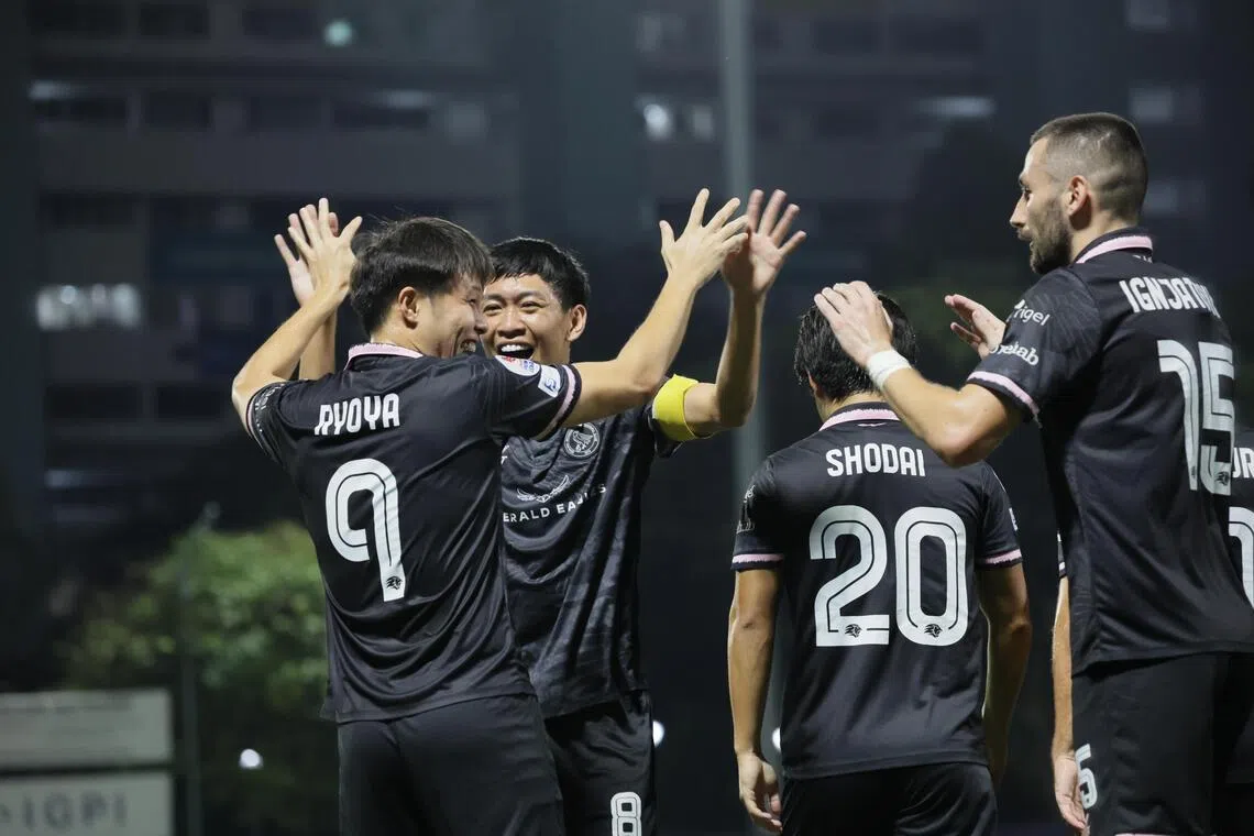 Ryoya Taniguchi (No. 9) celebrating with Geylang International teammates after scoring the opening goal in the 3-1 Singapore Premier League defeat of Tanjong Pagar United at the Jurong East Stadium on Feb 6.