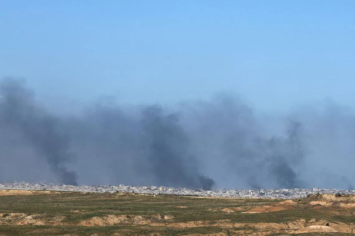 Smoke rises over Gaza, amid the ongoing conflict between Israel and the Palestinian Islamist group Hamas, as seen from southern Israel, December 29, 2023. REUTERS/Violeta Santos Moura