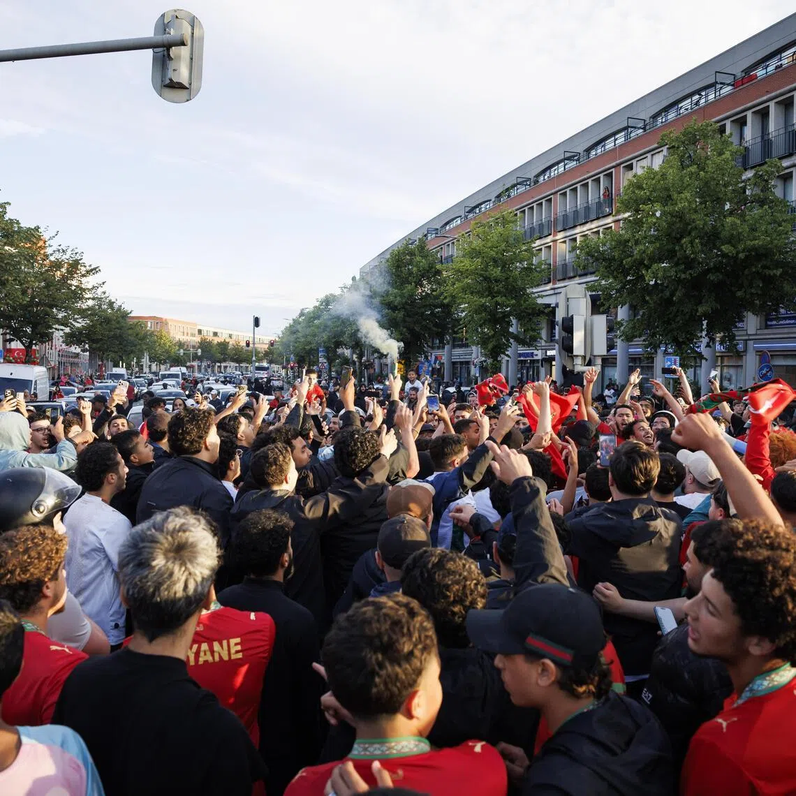 Fans of the Moroccan national soccer team celebrate in the Schilderswijk district of The Hague, The Netherlands, on June 30.