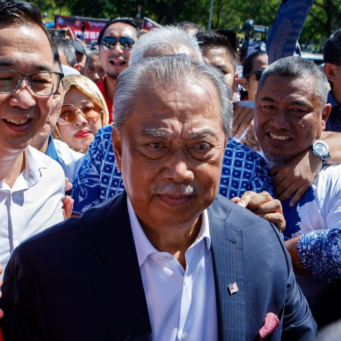 Former premier Muhyiddin Yassin (centre) arrives at the Malaysian Anti-Corruption Commission headquarters in Putrajaya, on March 9.