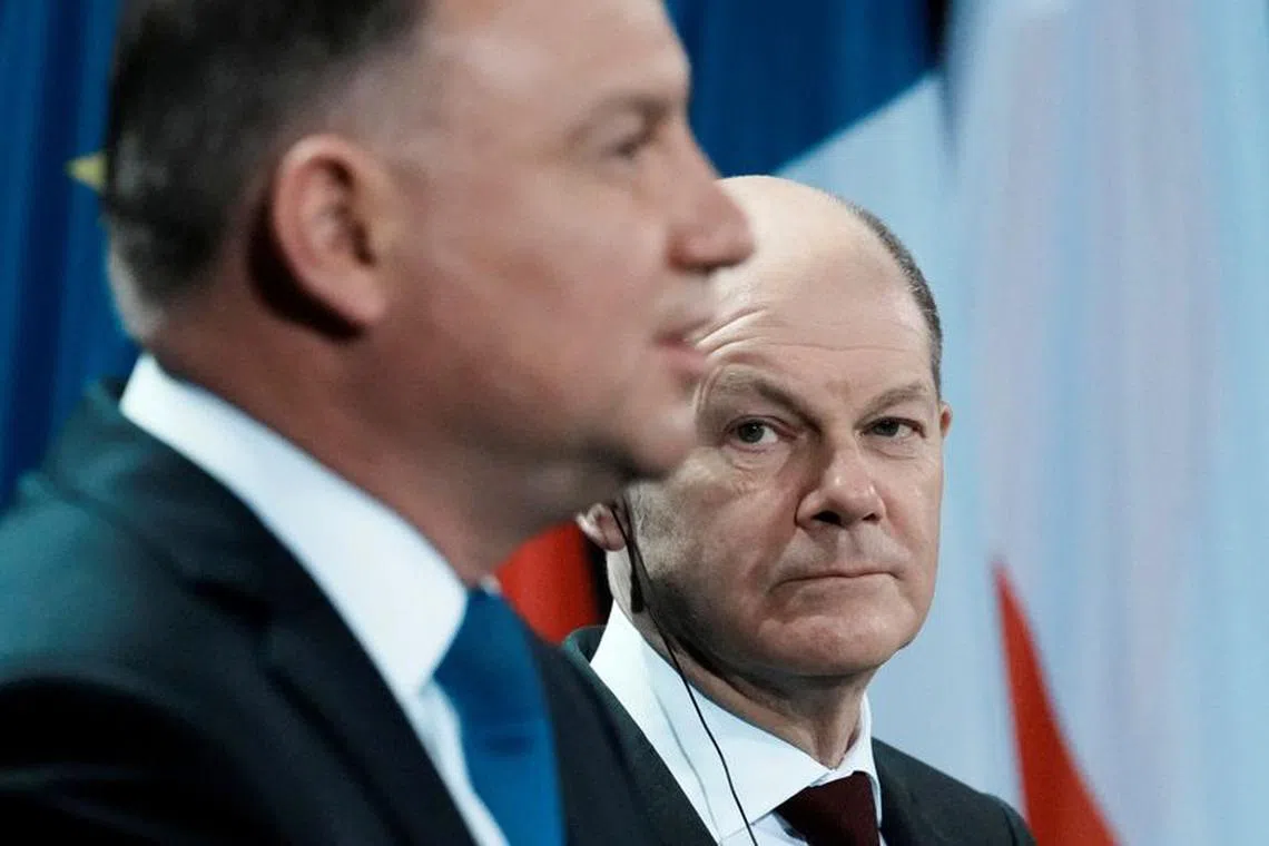 FILE PHOTO: German Chancellor Olaf Scholz and Polish President Andrzej Duda attend a joint news conference, ahead of a Weimar Triangle meeting to discuss the ongoing Ukraine crisis, in Berlin, Germany February 8, 2022. Thibault Camus/Pool via REUTERS/File Photo