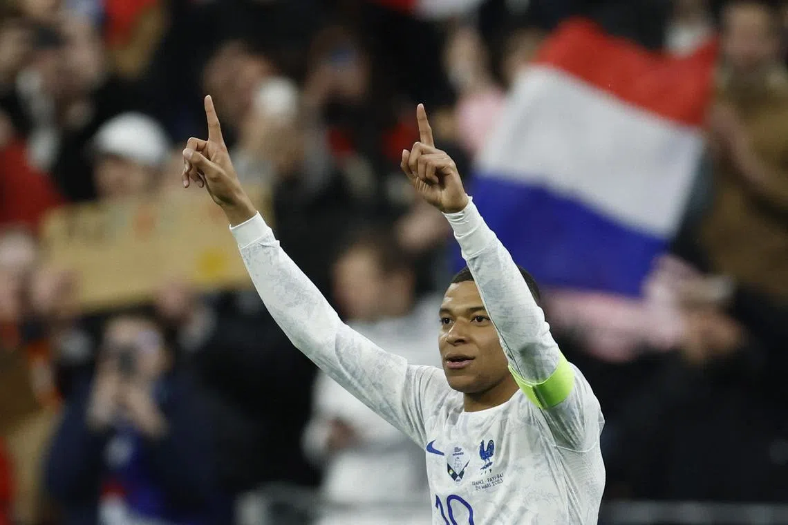 France's Kylian Mbappe celebrates scoring their third goal.