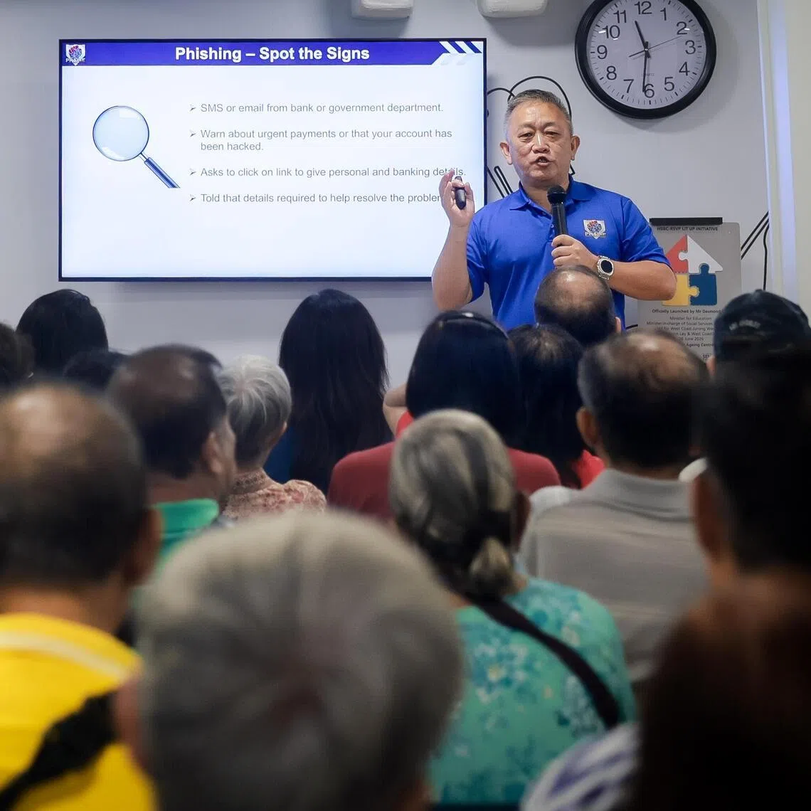 A speaker gives a talk on scam prevention to elderly residents during the launch of the HSBC Singapore and RSVP Singapore Lit Up Initiative at NTUC Health Active Ageing Centre (Boon Lay) on June 26.