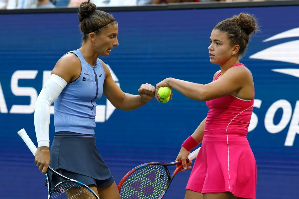 Sara Errani of and Jasmine Paolini bumping fist during the US Open women’s doubles semi-finals at the USTA Billie Jean King National Tennis Centre in Flushing Meadows on Sept 3, 2025. The duo will be action for holders Italy at the Sept 16-21 Billie Jean King Cup Finals in Shenzhen.