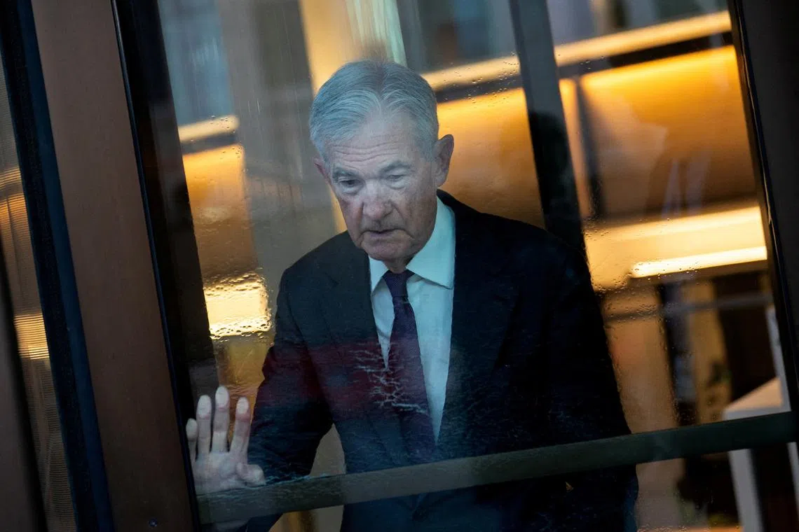 Federal Reserve Chair Jerome Powell pushes the door at the U.S. Federal Reserve in Washington, U.S., January 13, 2026. REUTERS/Nathan Howard