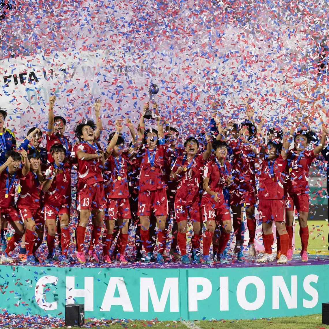 North Korea's players celebrate with the trophy after winning the FIFA U-17 women’s football World Cup.