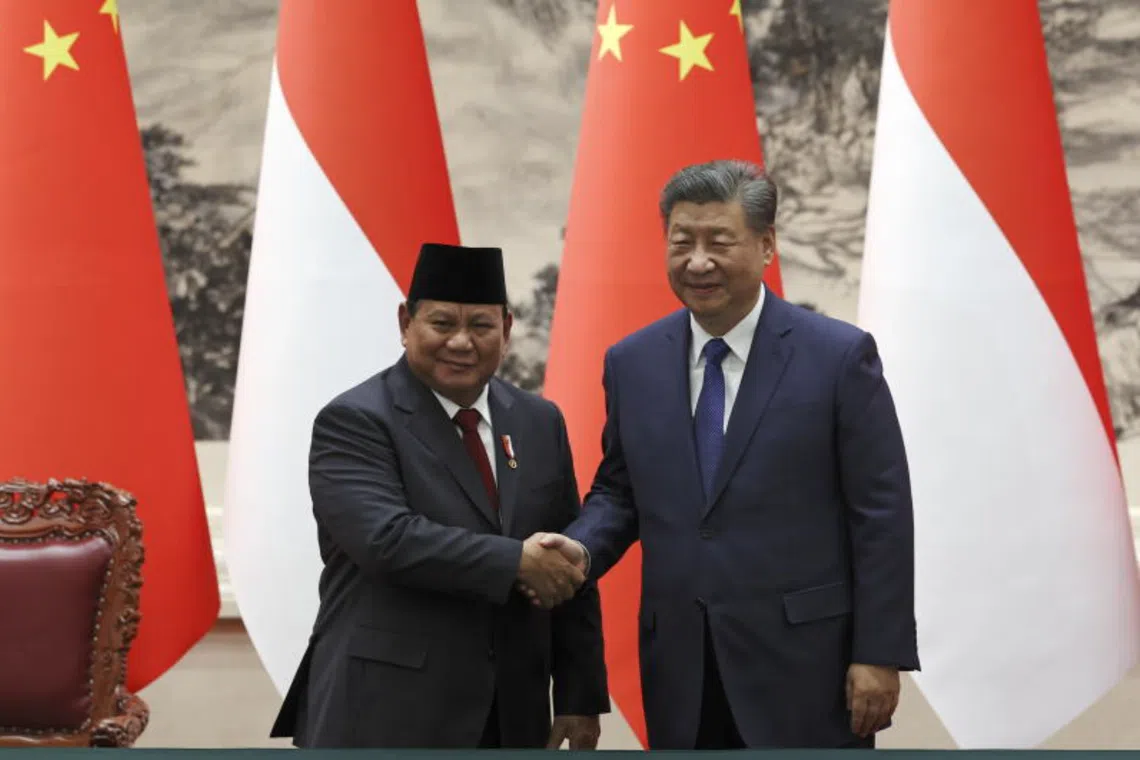 Chinese President Xi Jinping (R) and Indonesian President Prabowo Subianto (L) shake hands during a signing ceremony at the Great Hall of the People in Beijing, China, 09 Nov 2024. Prabowo is on a state visit to China from 08 to 10 Nov. 