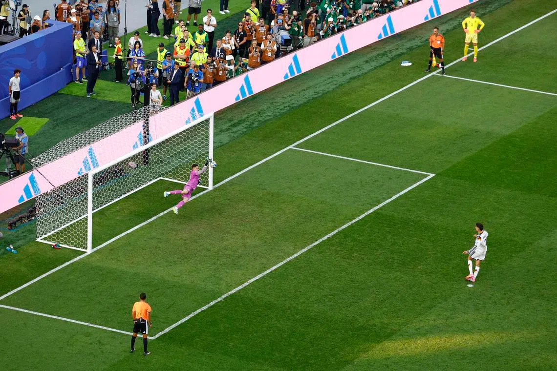Germany’s Kai Havertz (right) has his shot saved by Paraguay’s Orlando Gill during the penalty shoot-out.