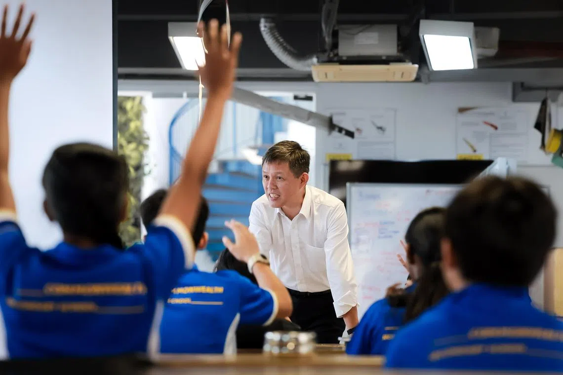 Minister for Education Chan Chun Sing speaking with students at Commonwealth Secondary School on April 24. 