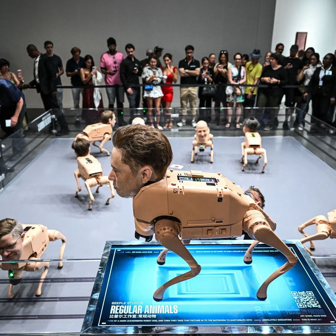 A wax head of Elon Musk on a robot dog, as a part of an art installation called "Regular Animals" by digital artist Mike Winkelmann, also known as Beeple, during Art Basel 2025 at the Miami Beach Convention Center in Miami Beach, Florida, on Dec 7, 2025. 