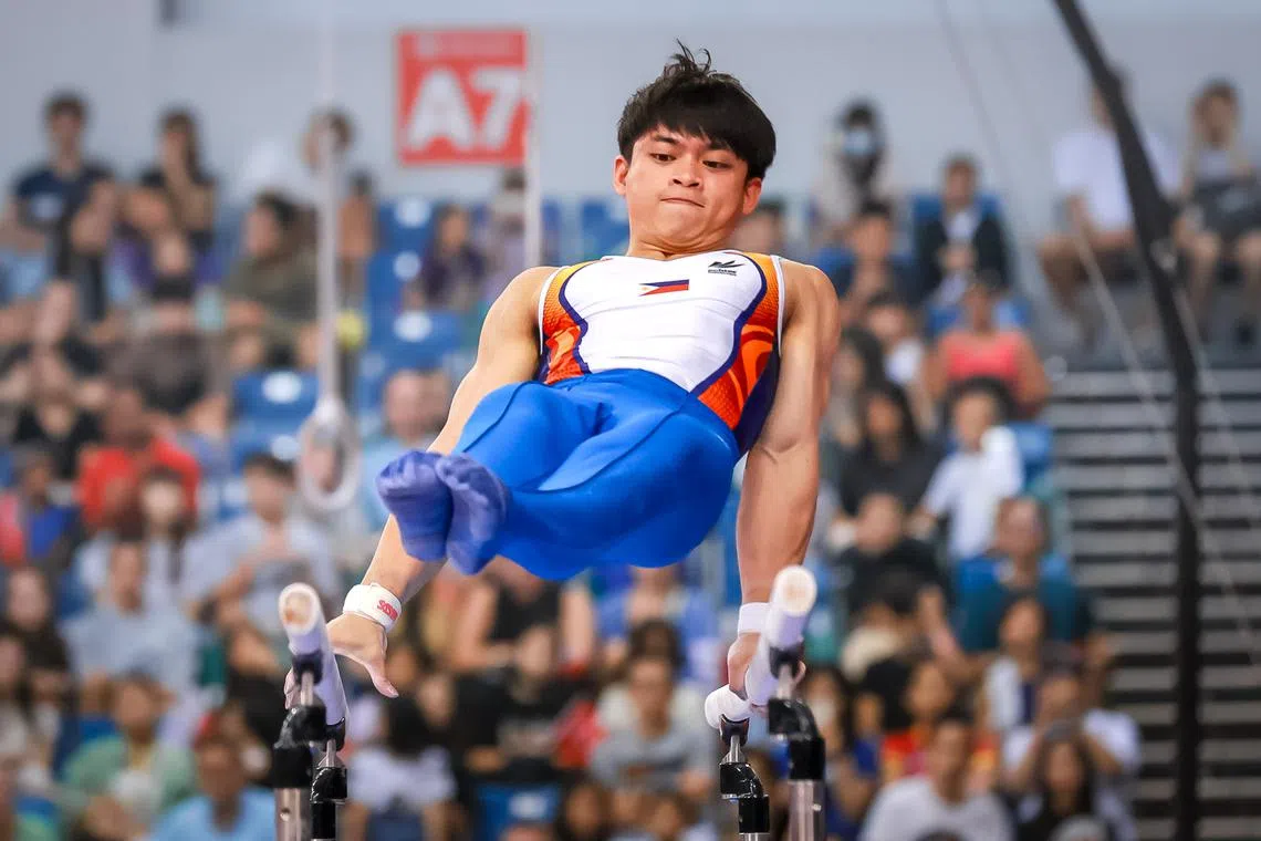 Philippines gymnast Carlos Yulo on the parallel bars at the Asian Artistic Gymnastics Championships. Finals held at OCBC Arena in June 2023.