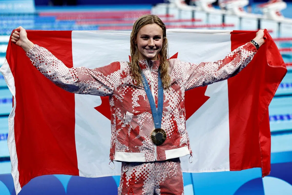 Paris 2024 Olympics - Swimming - Women's 200m Ind. Medley Victory Ceremony - Paris La Defense Arena, Nanterre, France - August 03, 2024. Gold medallist Summer McIntosh of Canada celebrates as shes poses with her medal after winning the women's 200m individual medley REUTERS/Clodagh Kilcoyne/File Photo