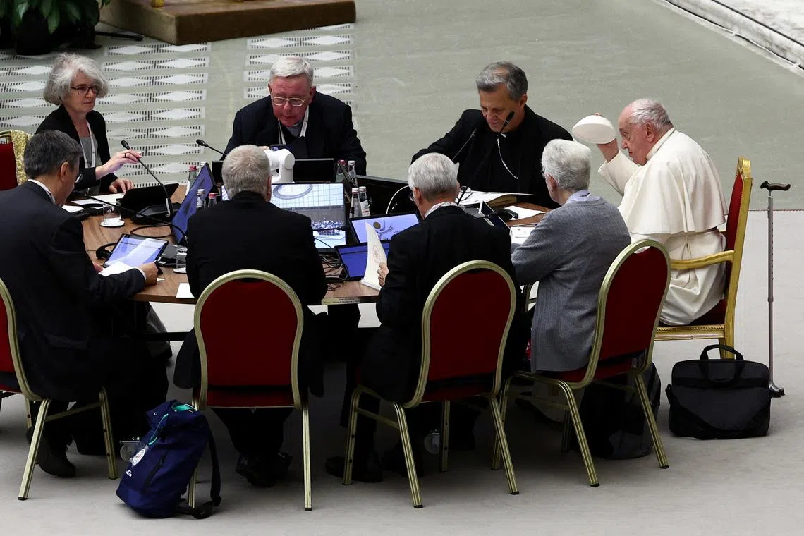 Pope Francis attends a meeting of the General Congregation of Synod of Bishops, in Paul VI hall, in Vatican City, October 21, 2024. REUTERS/Guglielmo Mangiapane