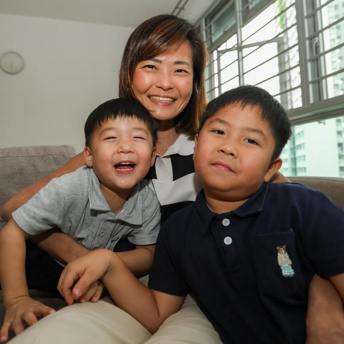 Ms Chia An An, 35, with her sons, Nathaniel Tan, 6, (right) and Timothy Tan, 3, at their home.