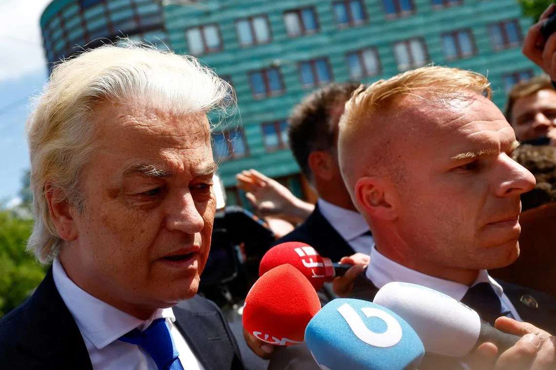 FILE PHOTO: Dutch far-right leader Geert Wilders speaks to the media on the day he campaigns for the EU elections, visiting a market in The Hague, Netherlands June 5, 2024. REUTERS/Piroschka van de Wouw/File Photo