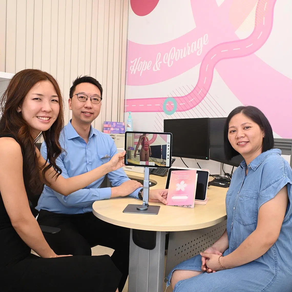 (From left) Dr Jolie Hwee, Head of KTPH's plastic, reconstructive & aesthetics surgery, Dr Clement Chia, head of KTPH's breast surgery department with patient Jane Din.