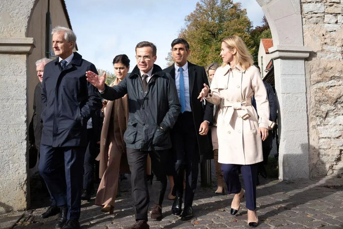 British Prime Minister Rishi Sunak walks through the town of Visby with other political leaders on their way to lunch at a restaurant during their Joint Expeditionary Summit (JEF) on the Baltic island of Gotland, Sweden.  Picture date: Friday October 13, 2023. Stefan Rousseau/Pool via REUTERS