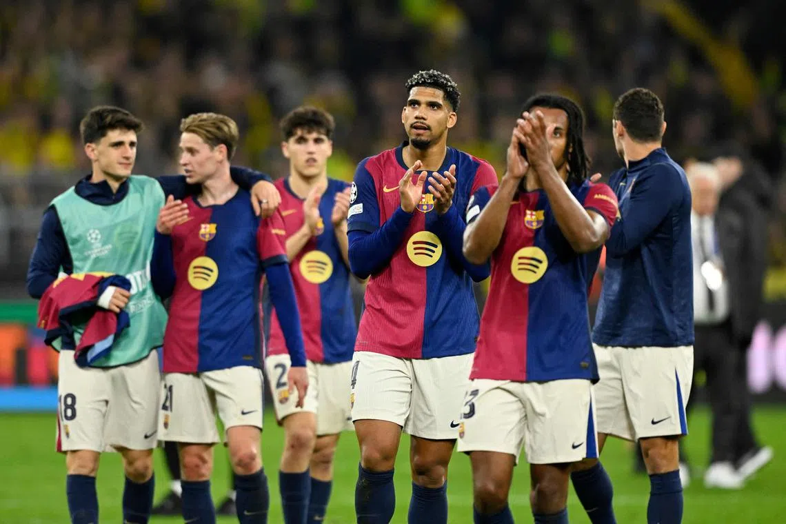 Barcelona players celebrating at the end of their quarter-final second leg match against Borussia Dortmund, on April 15.