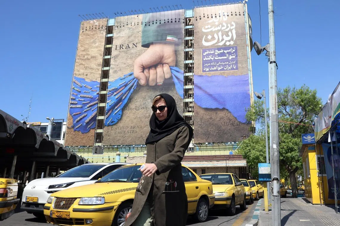 A billboard referring to the Strait of Hormuz and reading in Persian “Forever on Iran's hand” is displayed in Tehran.
