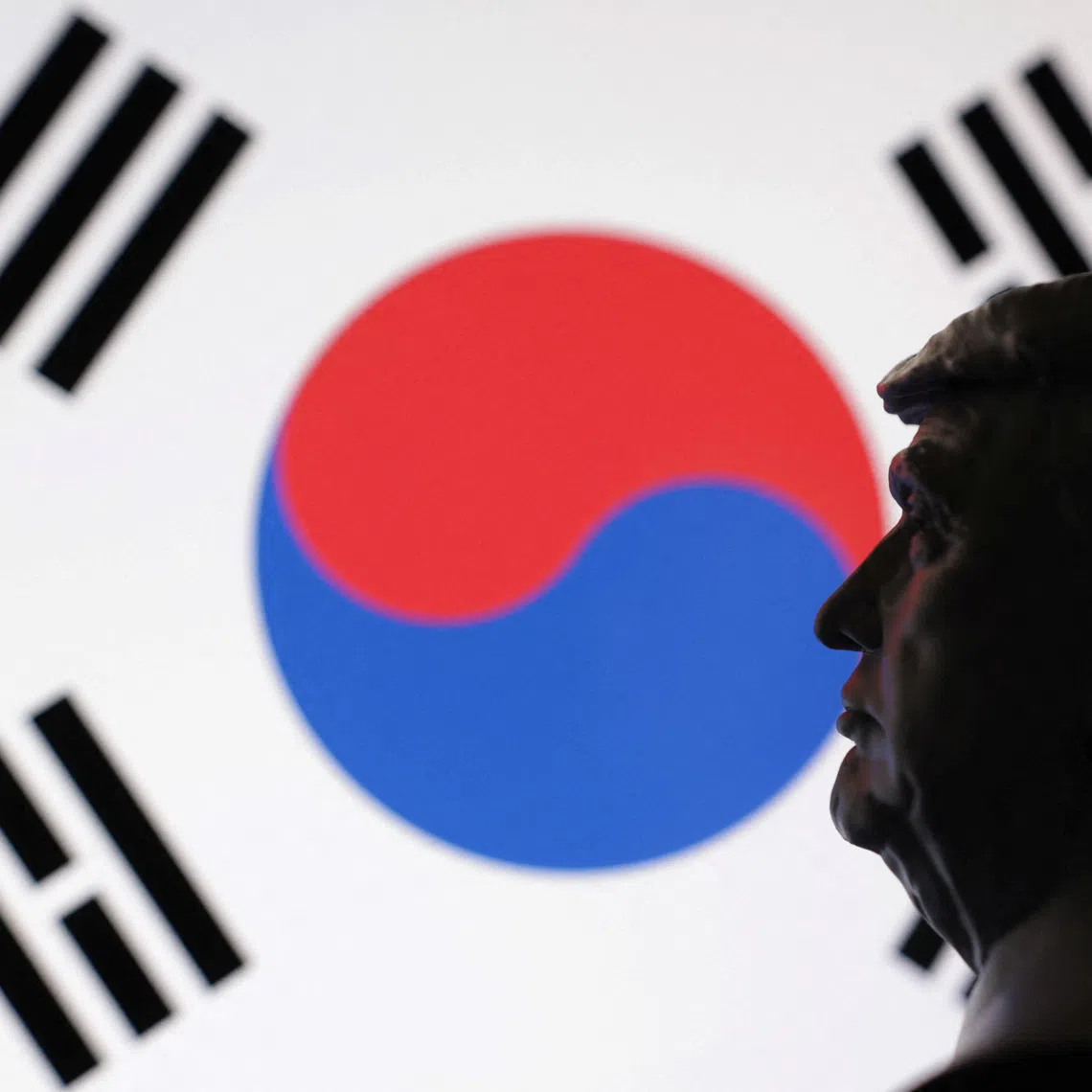 A 3D-printed miniature model of U.S. President Donald Trump and the South Korea flag are seen in this illustration taken July 23, 2025. REUTERS/Dado Ruvic/Illustration