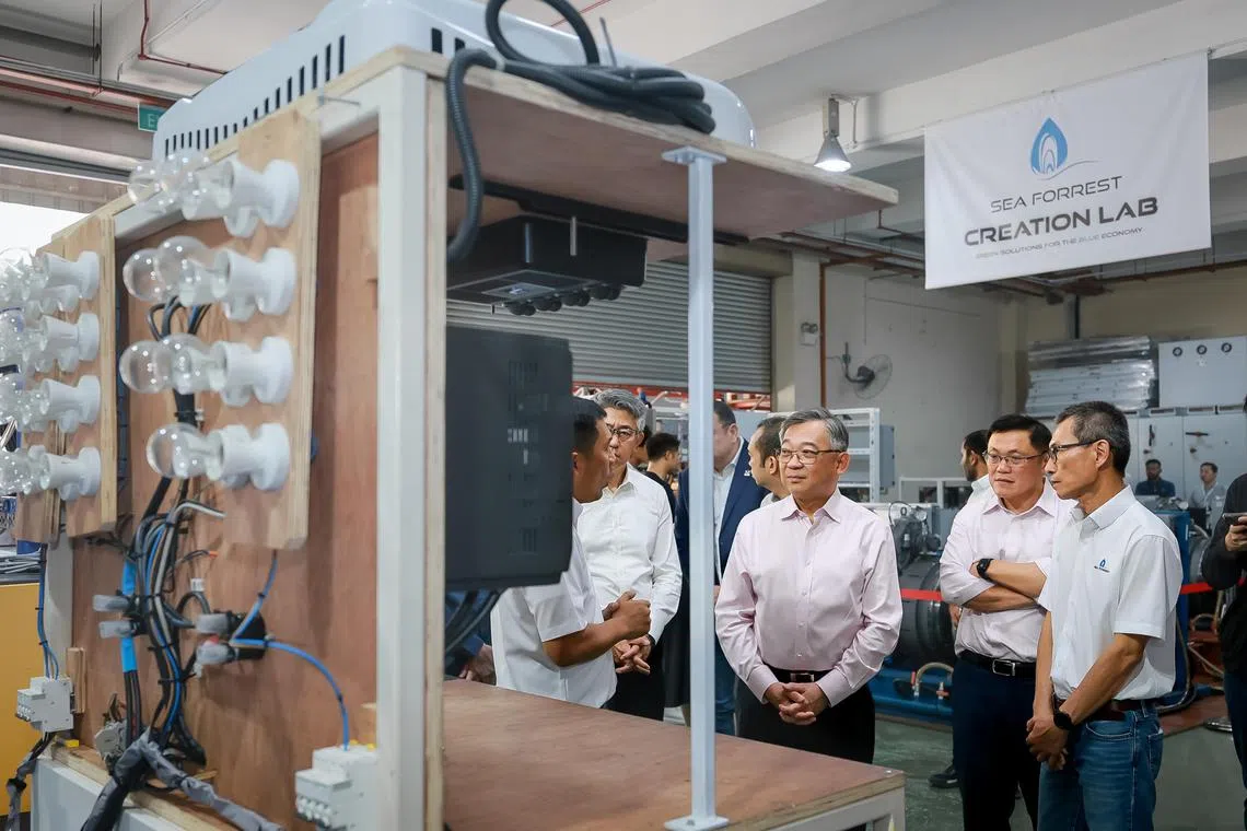 Trade and Industry Minister Mr Gan Kim Yong at a tour of Sea Forrest’s sustainability solutions at their Creation Lab at Penjuru Lane, July 28, 2023.