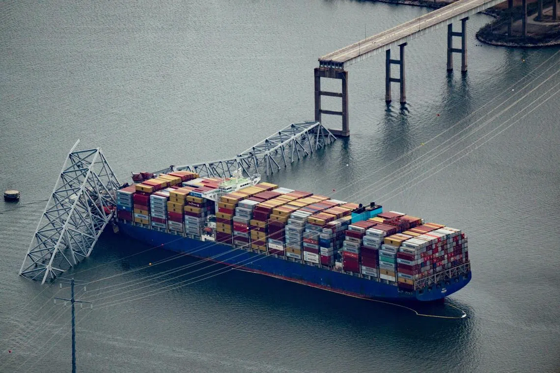 An aerial view of the cargo ship Dali that hit and collapsed the Francis Scott Key Bridge in Baltimore, March 26, 2024. The vessel suffered two blackouts while still in port, according to a preliminary report released on May 14, 2024. (Erin Schaff/The New York Times)